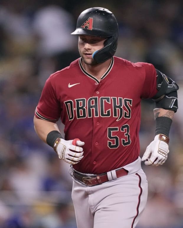 Sep 22, 2022; Los Angeles, California, USA; Arizona Diamondbacks designated hitter Christian Walker (53) rounds the bases after hitting a solo home run in the ninth inning against the Los Angeles Dodgers at Dodger Stadium. Mandatory Credit: Kirby Lee-USA TODAY Sports